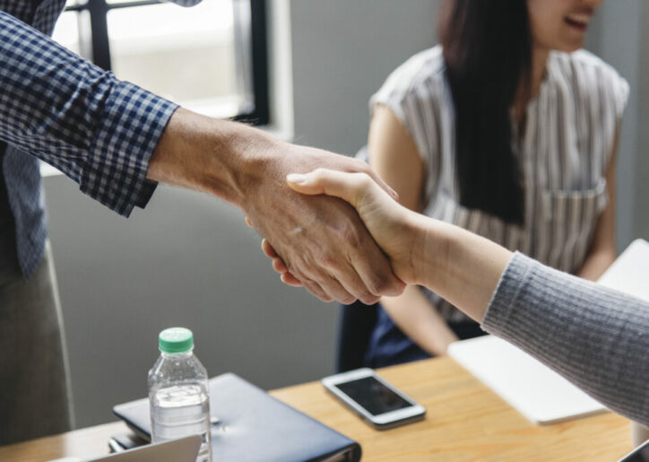 Business people shaking hands in agreement